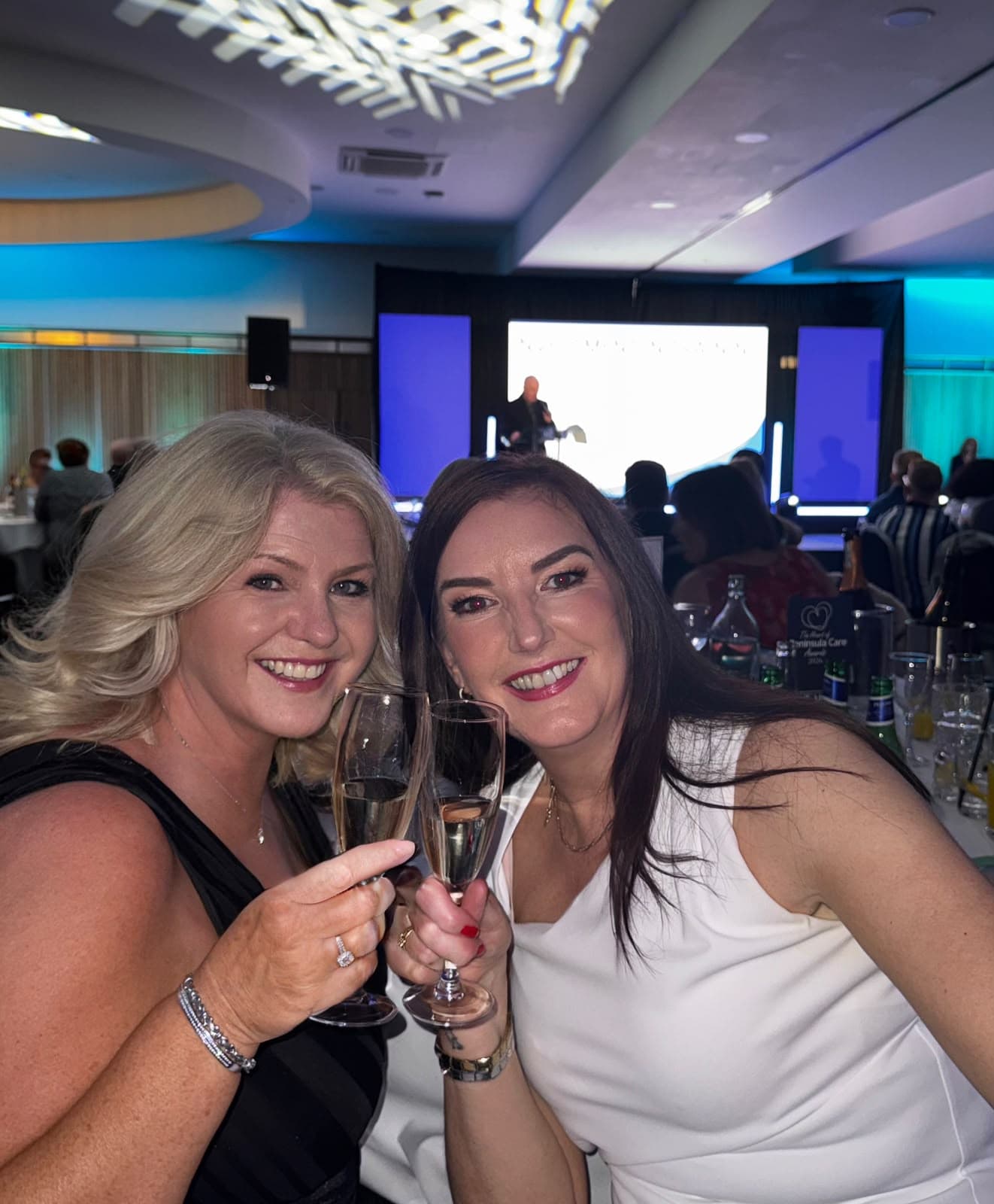 Electus Healthcare colleagues toasting at the Heart of Peninsula Care Awards